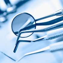 dentist's instruments with shallow depth of field blue tinted